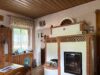 Freistehendes Wochenendhaus in Alleinlage mit herrlicher Fernsicht - Wohnzimmer/Kamin